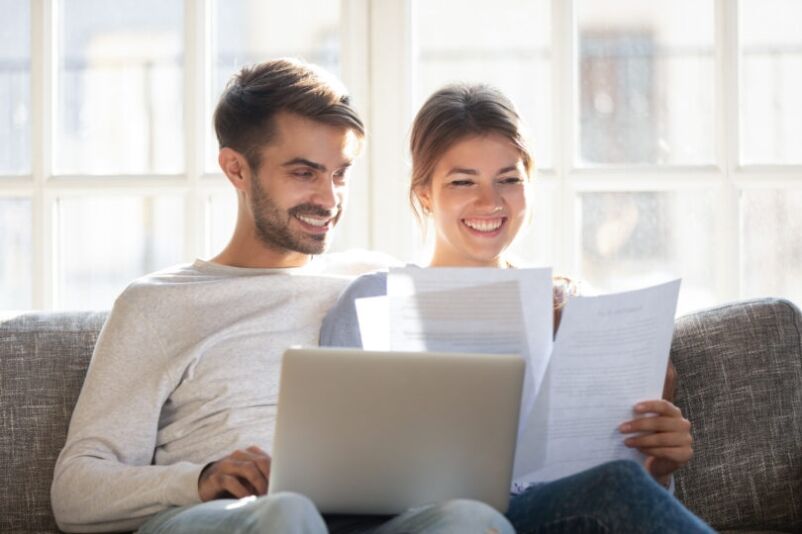 Couple organising required documents for UK mortgage application