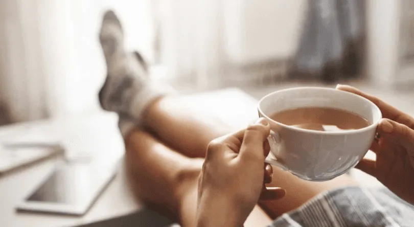 Person having tea after moving