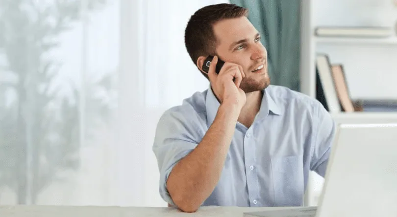 Self-employed business owner working from home with income protection insurance