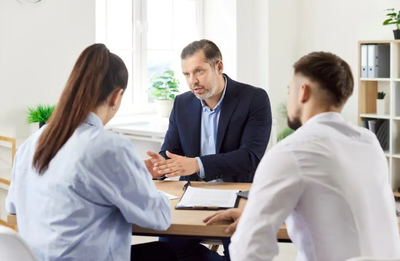Couple meeting mortgage adviser in the UK to discuss TSB ERC-free tracker mortgage options and flexible home loans