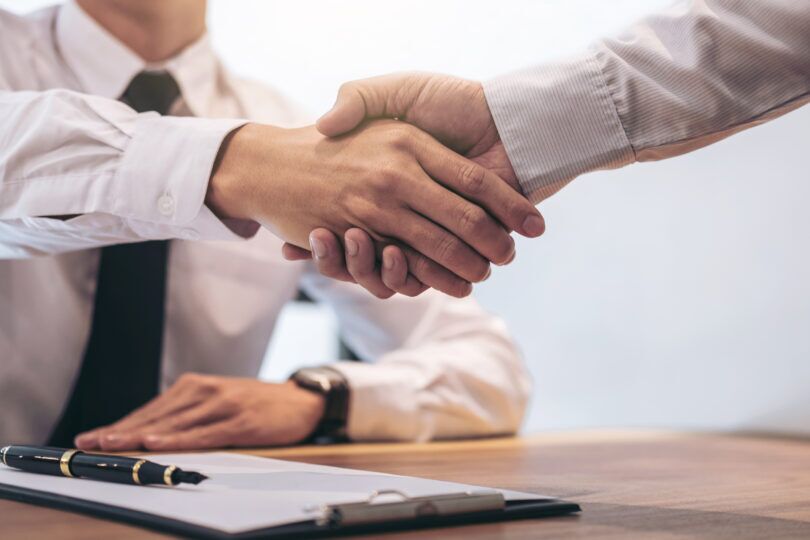 UK man meeting mortgage advisor to discuss Co-op Bank 80% LTV mortgage rates under 4%