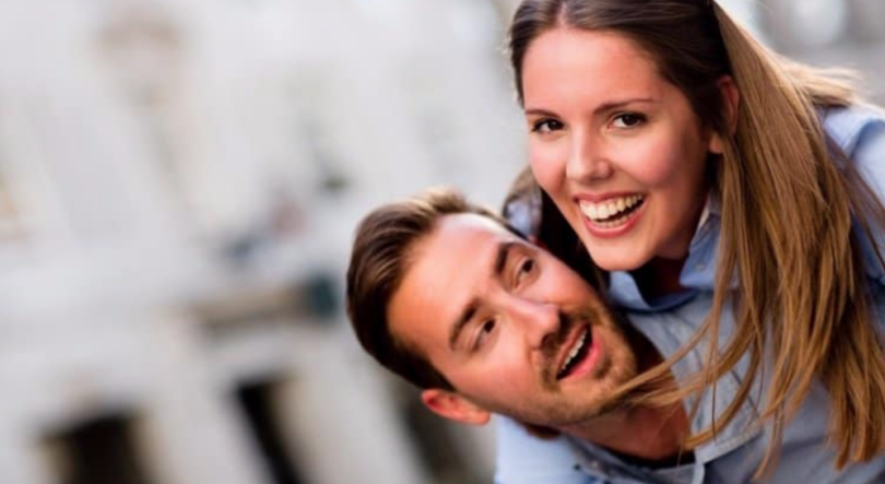 Couple smiling because of mortgage benefits